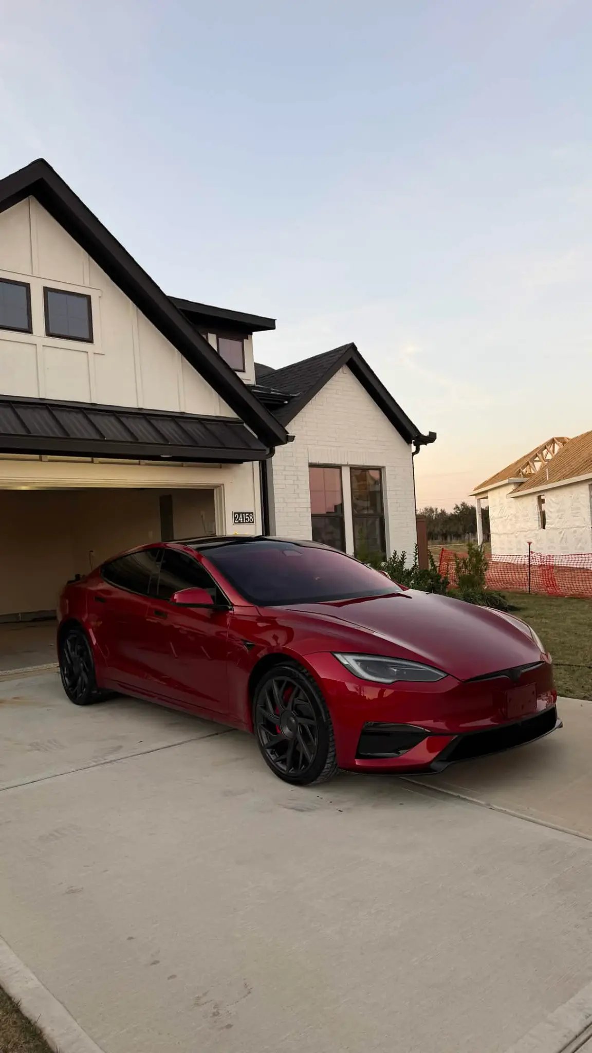 Red Tesla Model S Plaid ceramic coating Houston TX mobile detailing